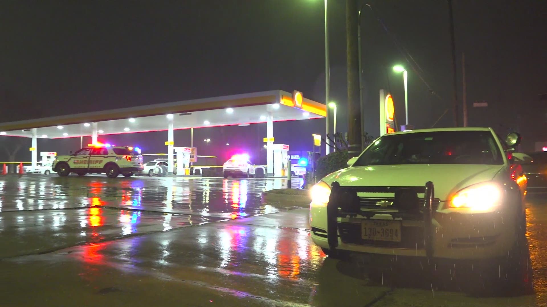 Deputies are looking for two suspects after a Shell gas station clerk was shot in the leg during a robbery Sunday morning.