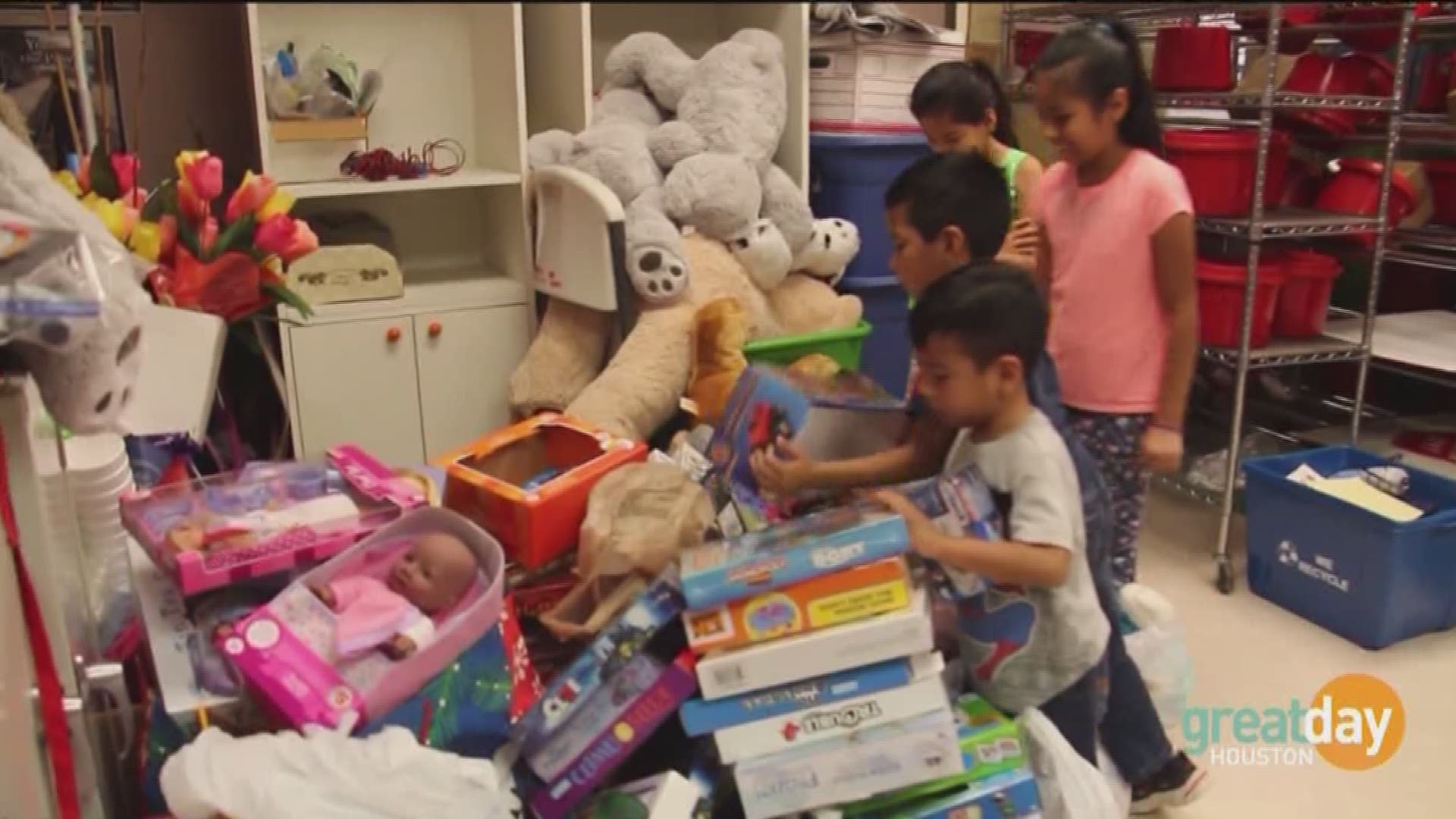 Captain Jenifer Phillips and Lt. Luis Villanueva explain the importance of donating toys to help neighbors celebrate the holidays.