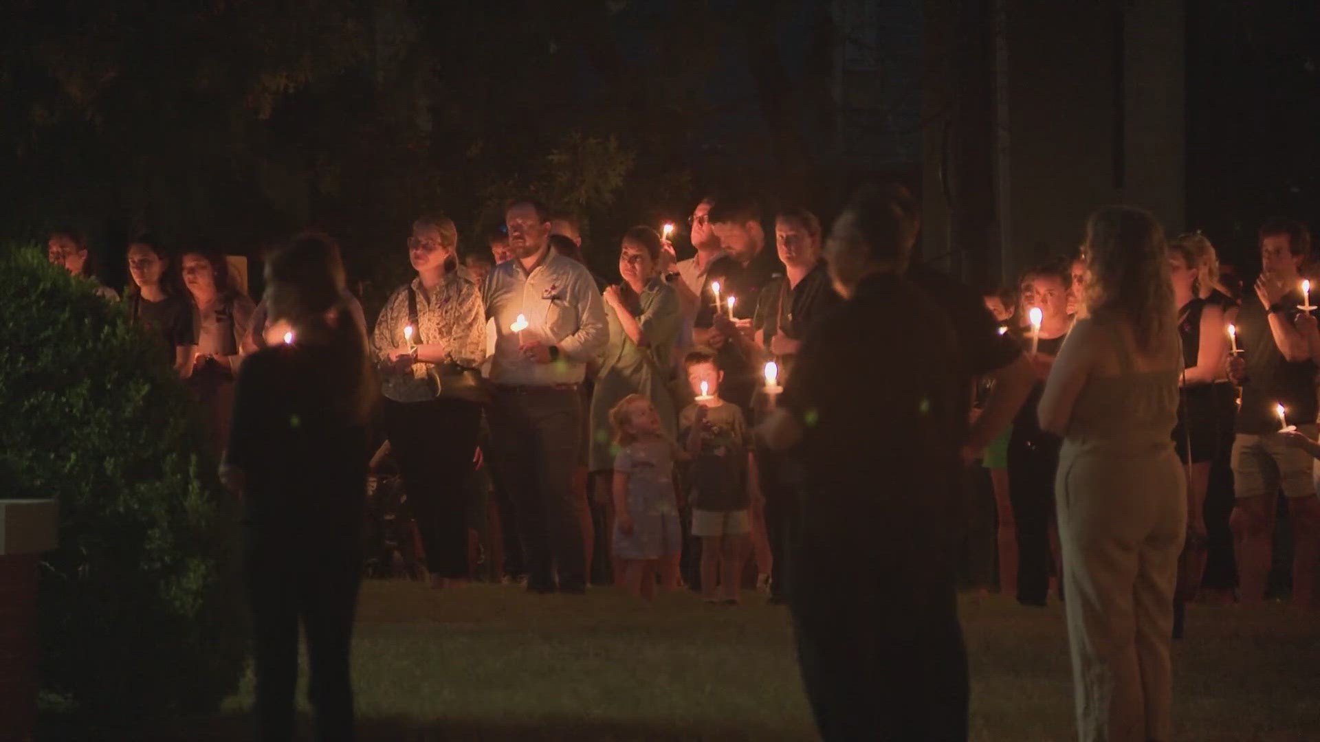 Hundreds of people made their way to Marmion Park off Heights Boulevard with lit candles to pay their respects to Christa Gilley.