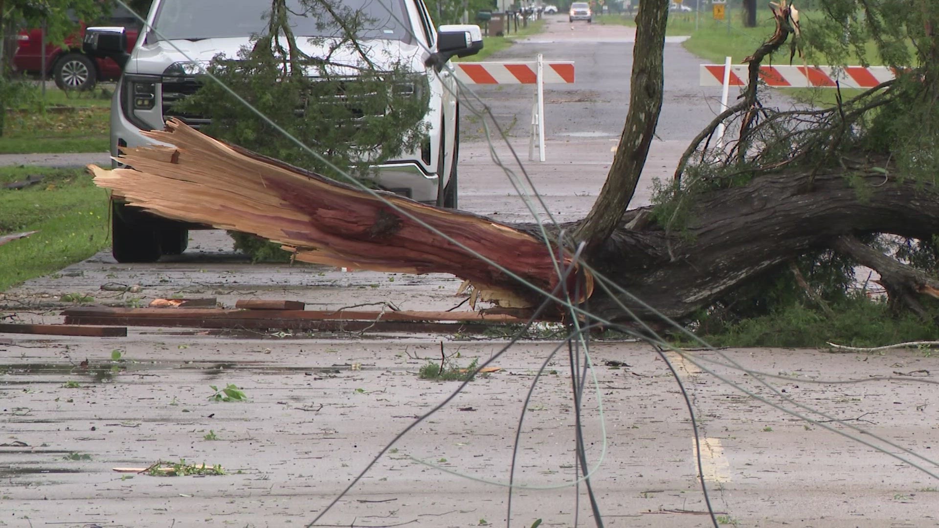 The storm brought down some power poles and trees in the Galveston area Wednesday morning.