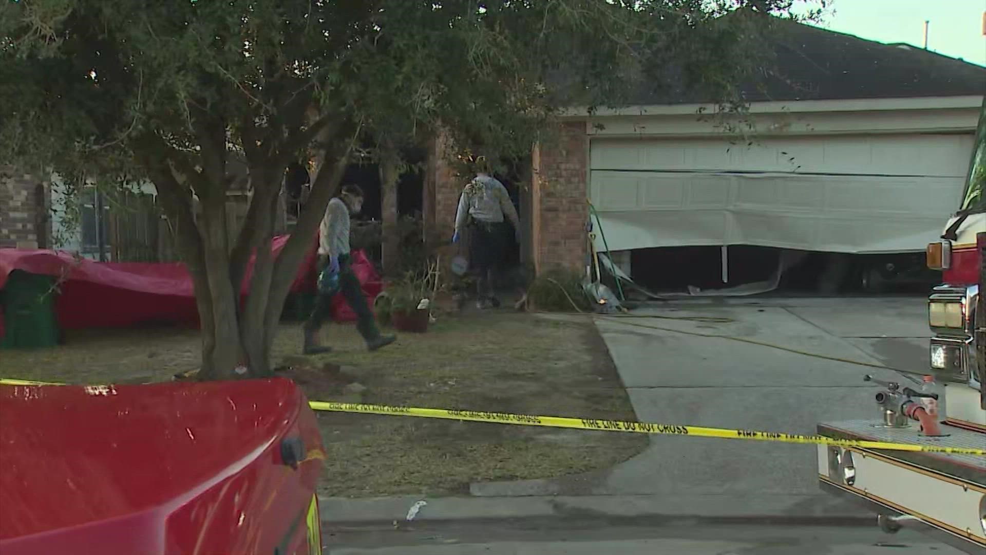 Harris County sheriff's deputies are saying a woman found dead after a house fire had wounds inconsistent with a fire. Her grandchildren and son remain hospitalized