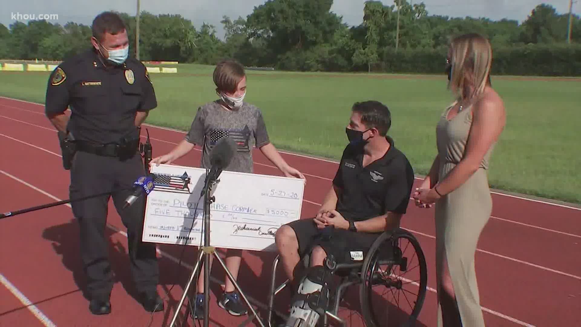 Police officer Chase Cormier was presented with a $5,000 check Saturday from Running 4 Heroes, a nonprofit organization created to raise money for first responders.