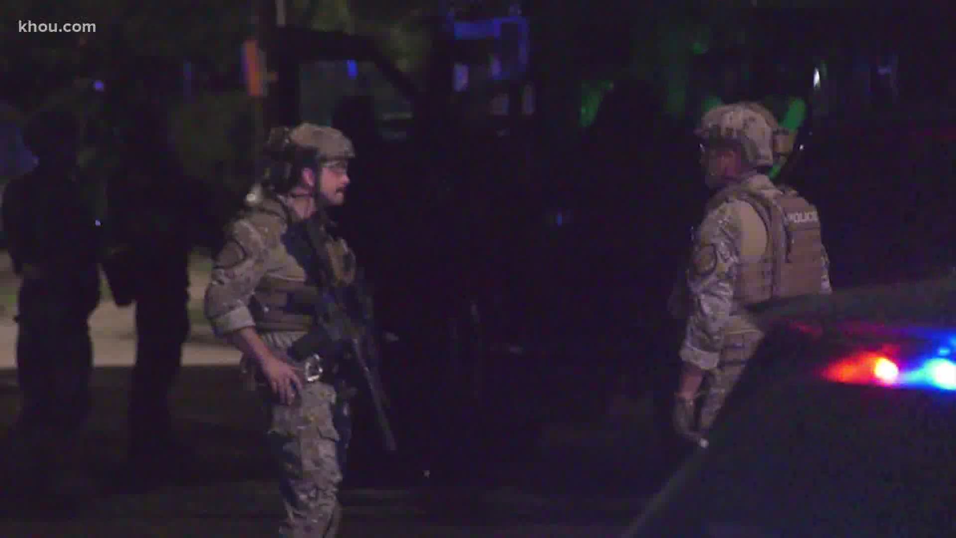 A woman arrested and charged with assault after a standoff with SWAT officers at a home in southwest Houston.