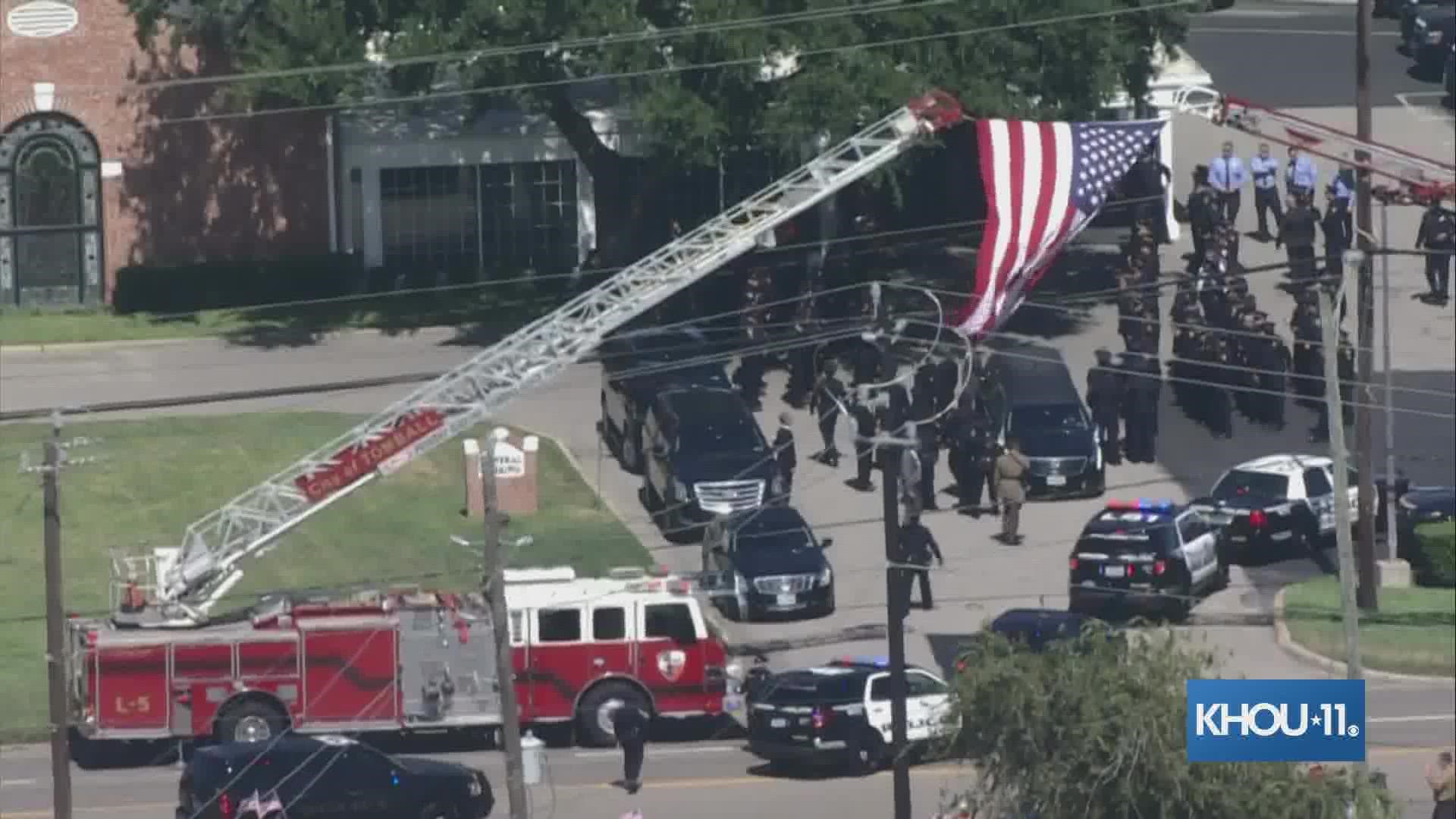 A sea of officers awaited the arrival of fallen HPD officer Bill Jeffrey as his procession arrived at a funeral home in Tomball.