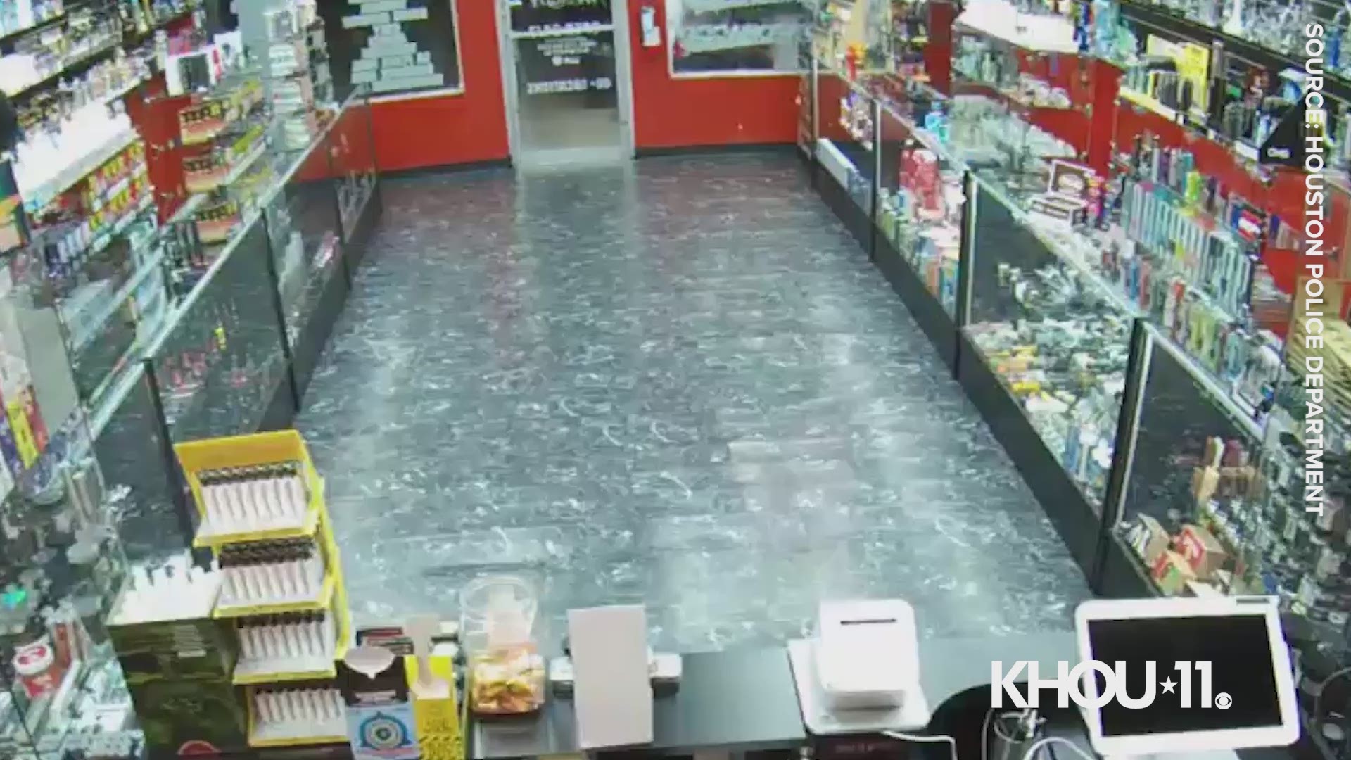 Houston police released surveillance video Tuesday of two suspects accused of robbing a vape shop near the Northwest Freeway at gunpoint.