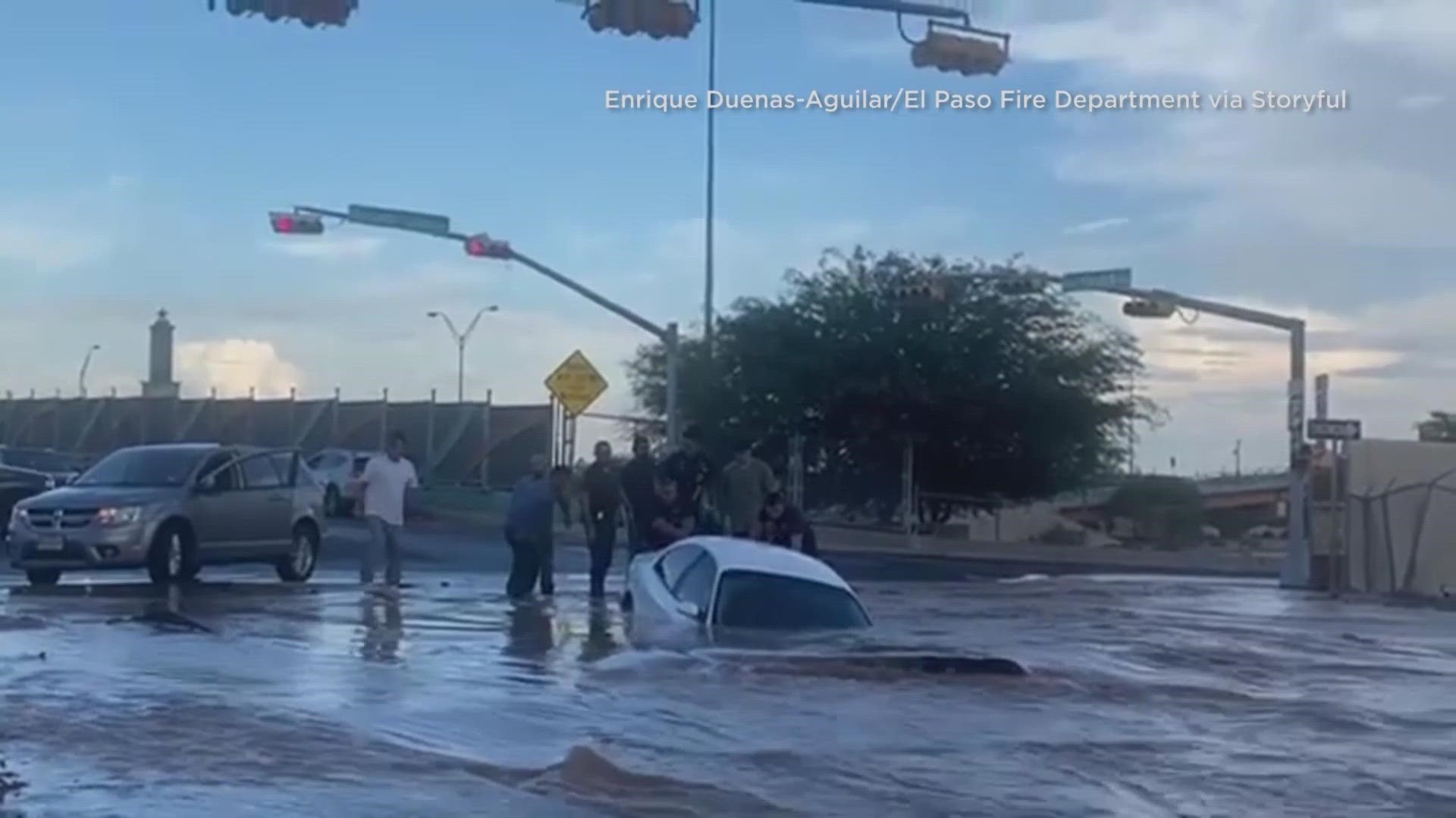 El Paso Water officials said a water main break underground caused the sinkhole in central El Paso in which a vehicle submerged and a woman had to be rescued Tuesday