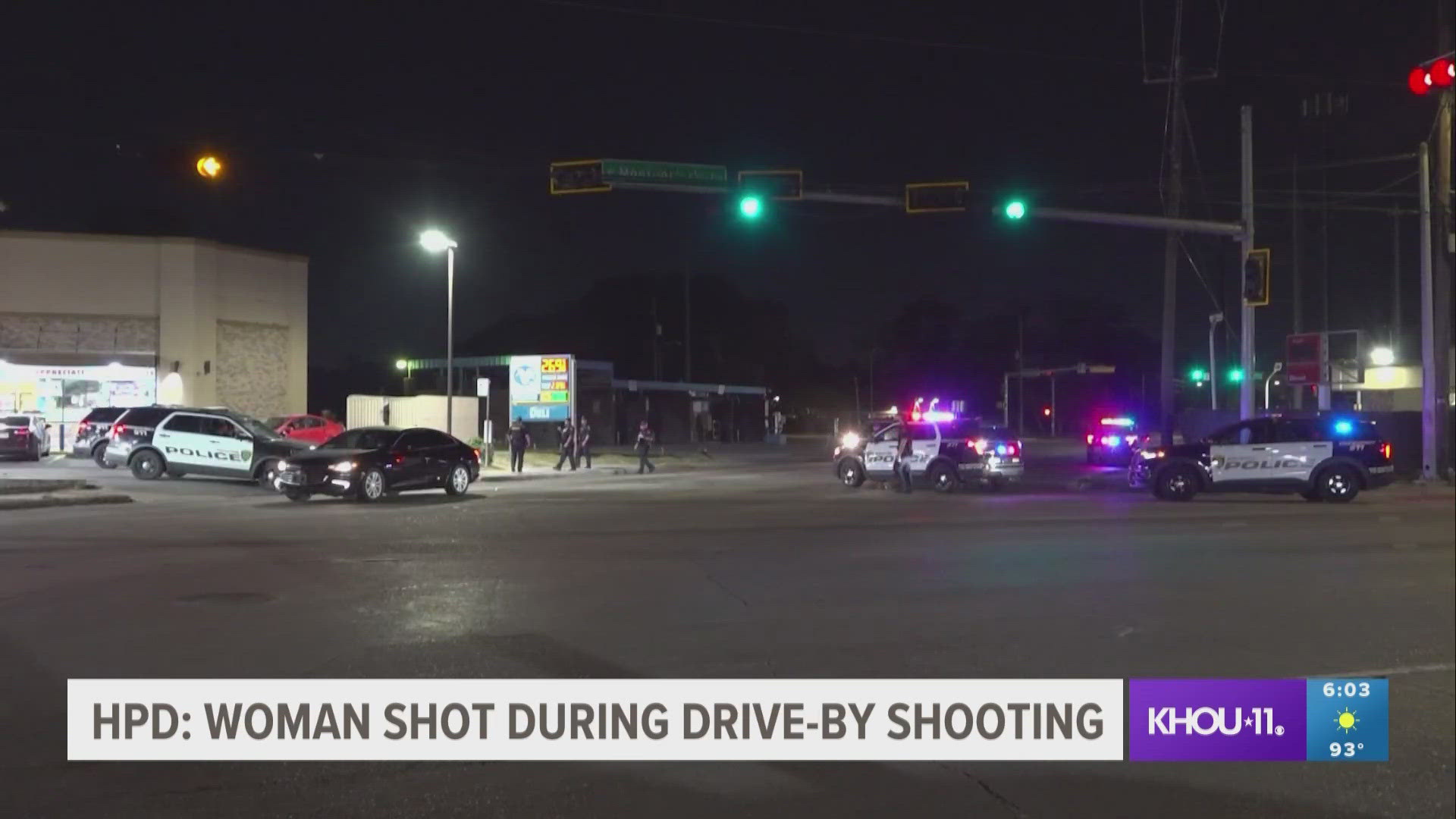 The woman was standing in a parking lot when a red truck drove by and started shooting at her, according to police.