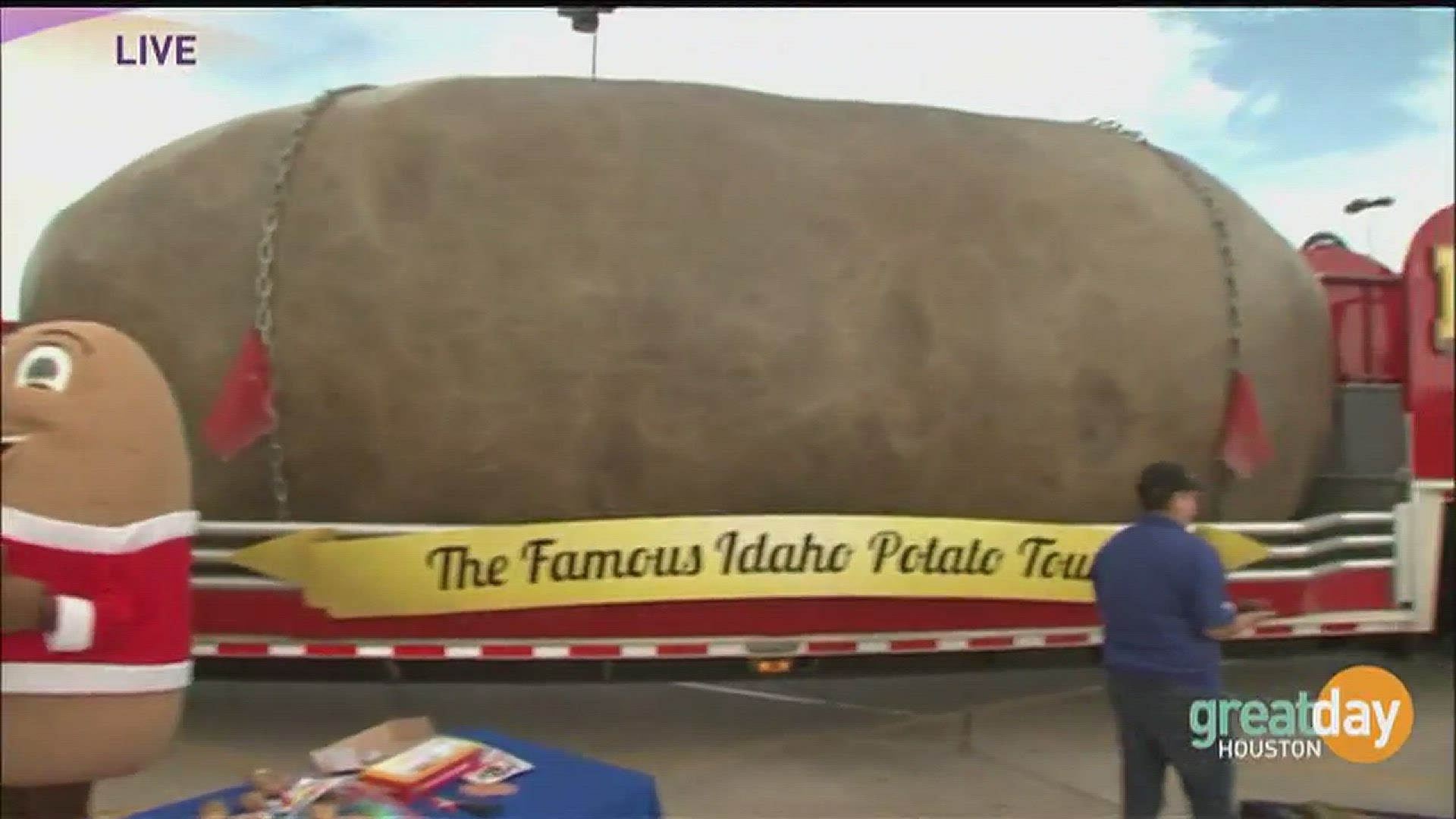 Great Day's Cristina Kooker takes a bite out of the world's largest potato, just one of the hundreds of attractions at McDonald's Houston Children Festival.