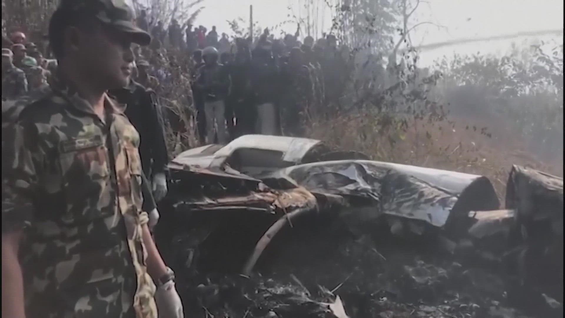 The aircraft's fuselage was split into multiple parts, and videos showed billowing smoke as rescuers searched for survivors.