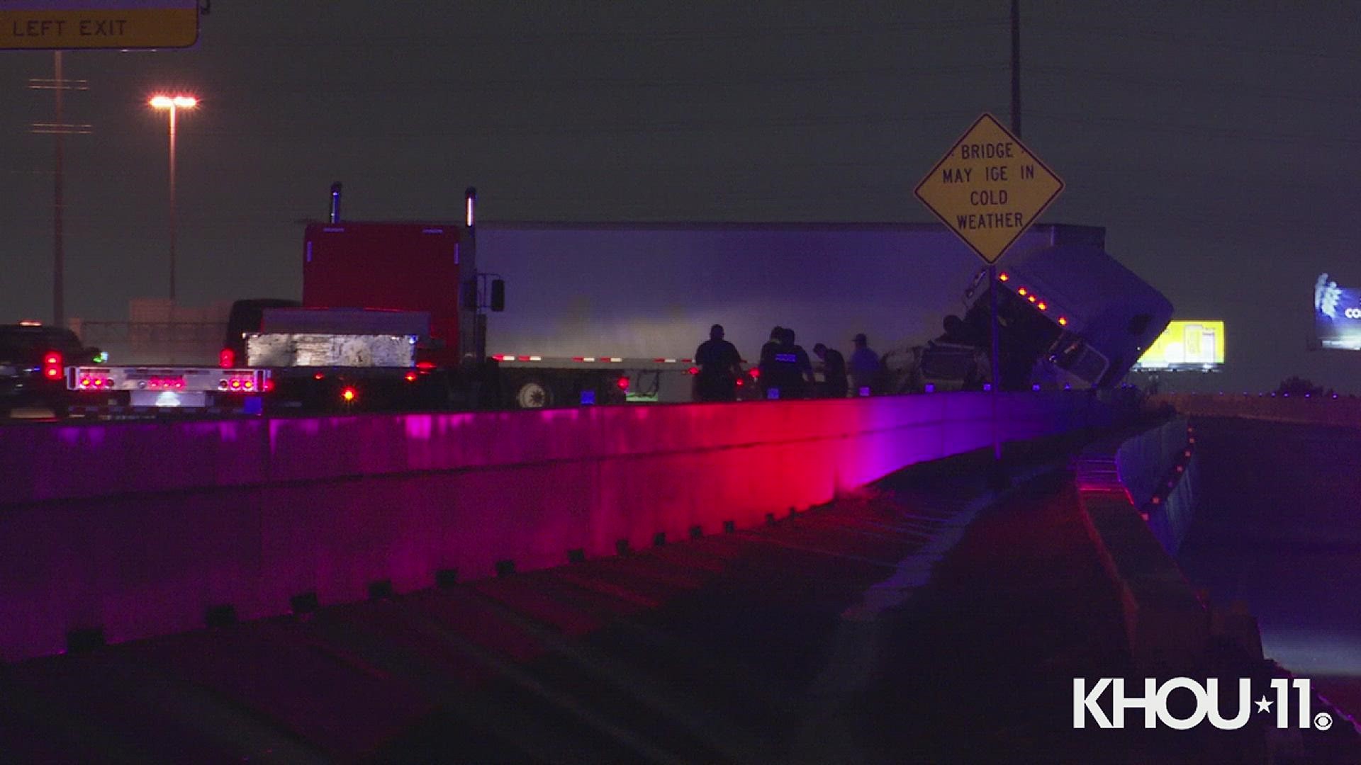 A big rig crashed into a barrier sending concrete flying across the Katy Freeway Tuesday morning.