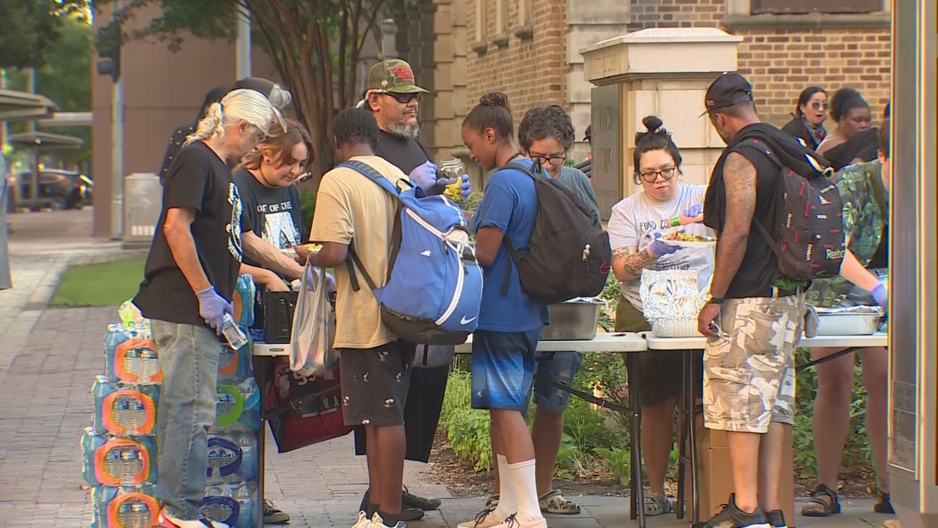 Outside the Houston Public Library, a sense of unity and pride is what motivated the dozens of volunteers who gathered with the organization "Food Not Bombs."