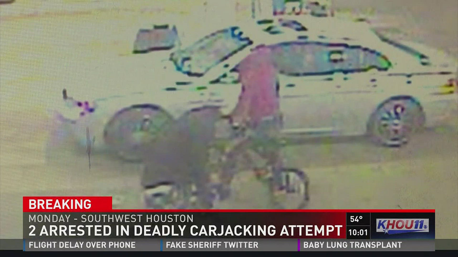 Houston police say two suspects have been arrested in an attempted carjacking and fatal shooting of a woman Monday in southwest Houston.