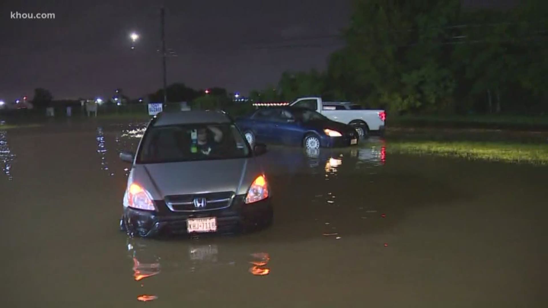 Several cars were stranded along roads near Hobby Airport due to flooding from Tropical Depression Imelda.
