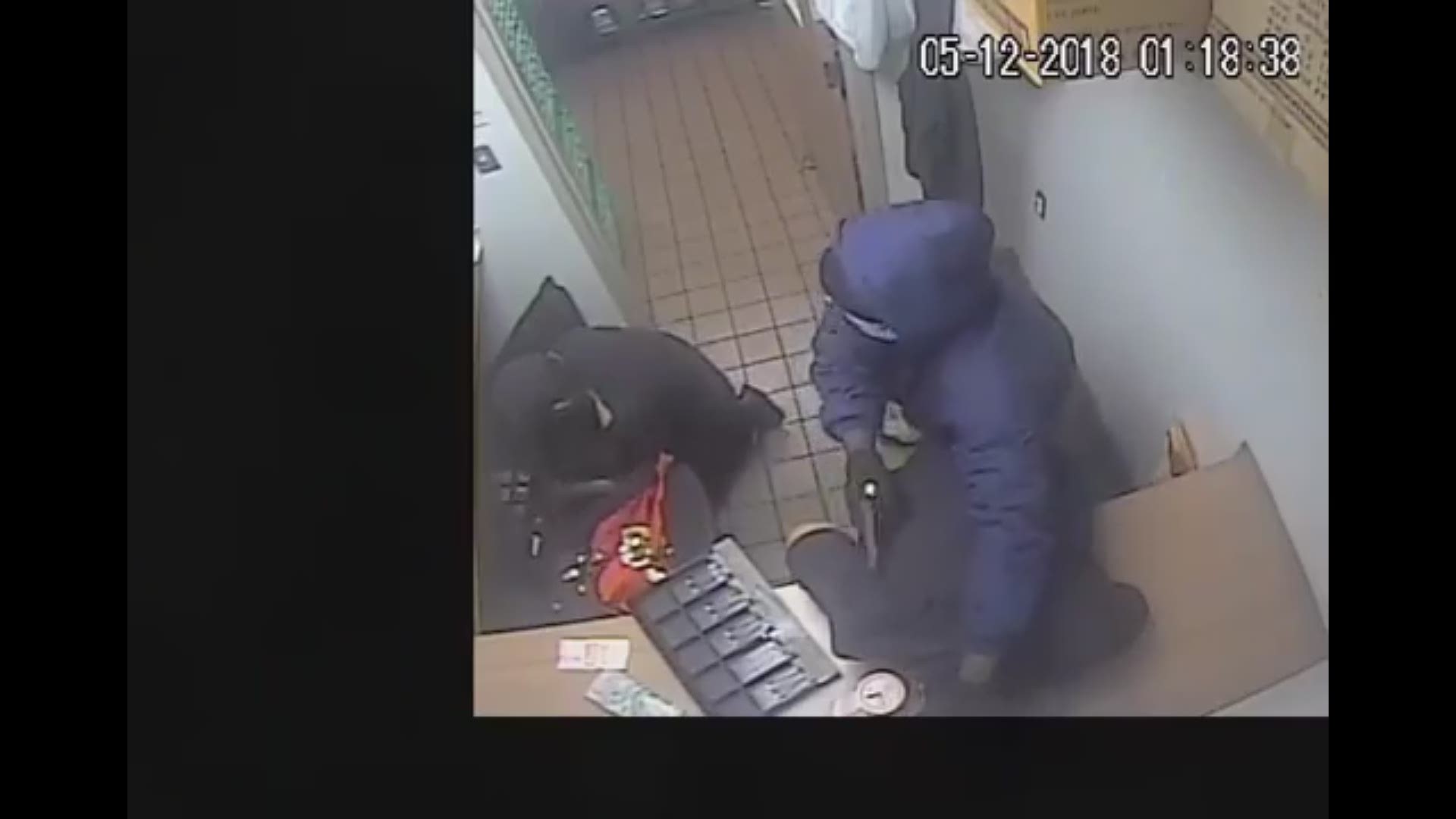 Video from HPD shows a masked robbery on Wilcrest Drive in SW Houston.