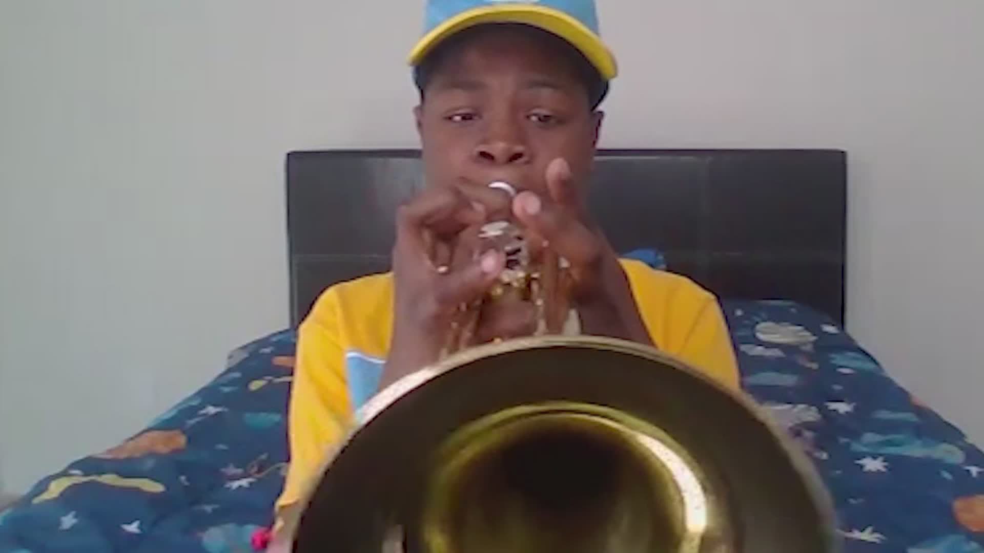 A fifth grader is now an honorary band member at Southern University and it all started with a homemade video and a generous district employee.