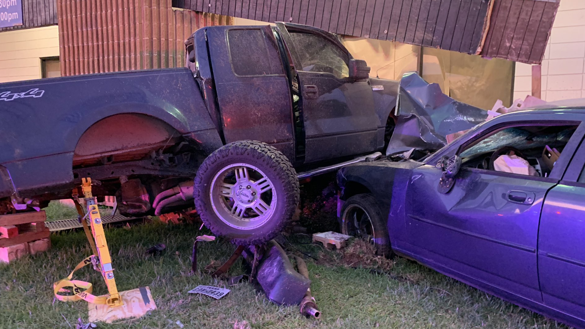 Harris County deputies said two Dodge Chargers were racing when one of them crashed into a truck and pushed it into a building, killing the driver of the truck.