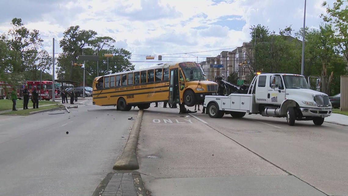 Spring Branch ISD school bus with students inside flips on its side ...
