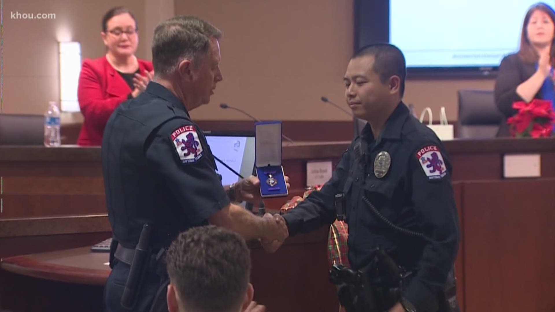 Officer Ruoming Bi was honored Thursday for his heroic actions back in September.