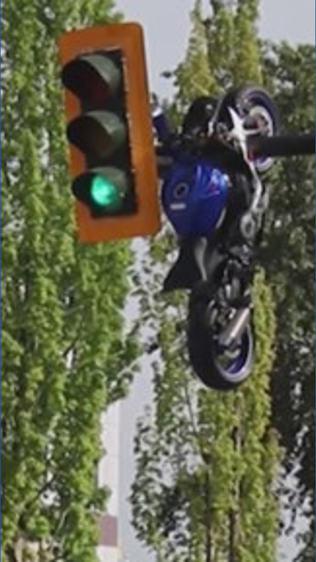 Motorcycle ends up on traffic light | khou.com