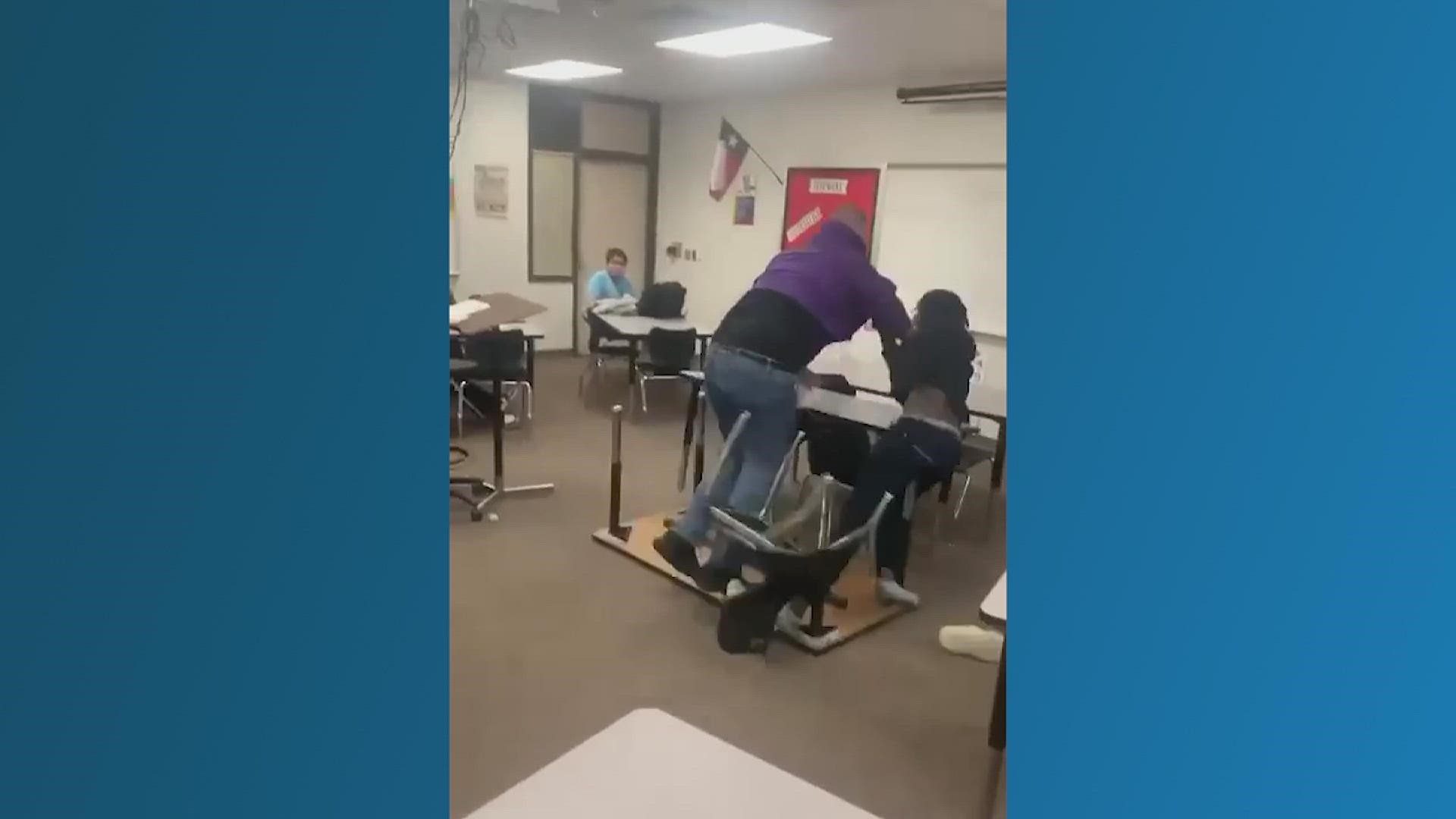 The district said the teacher was helping out in another classroom when he used physical force to try to get a student to take a seat and listen.