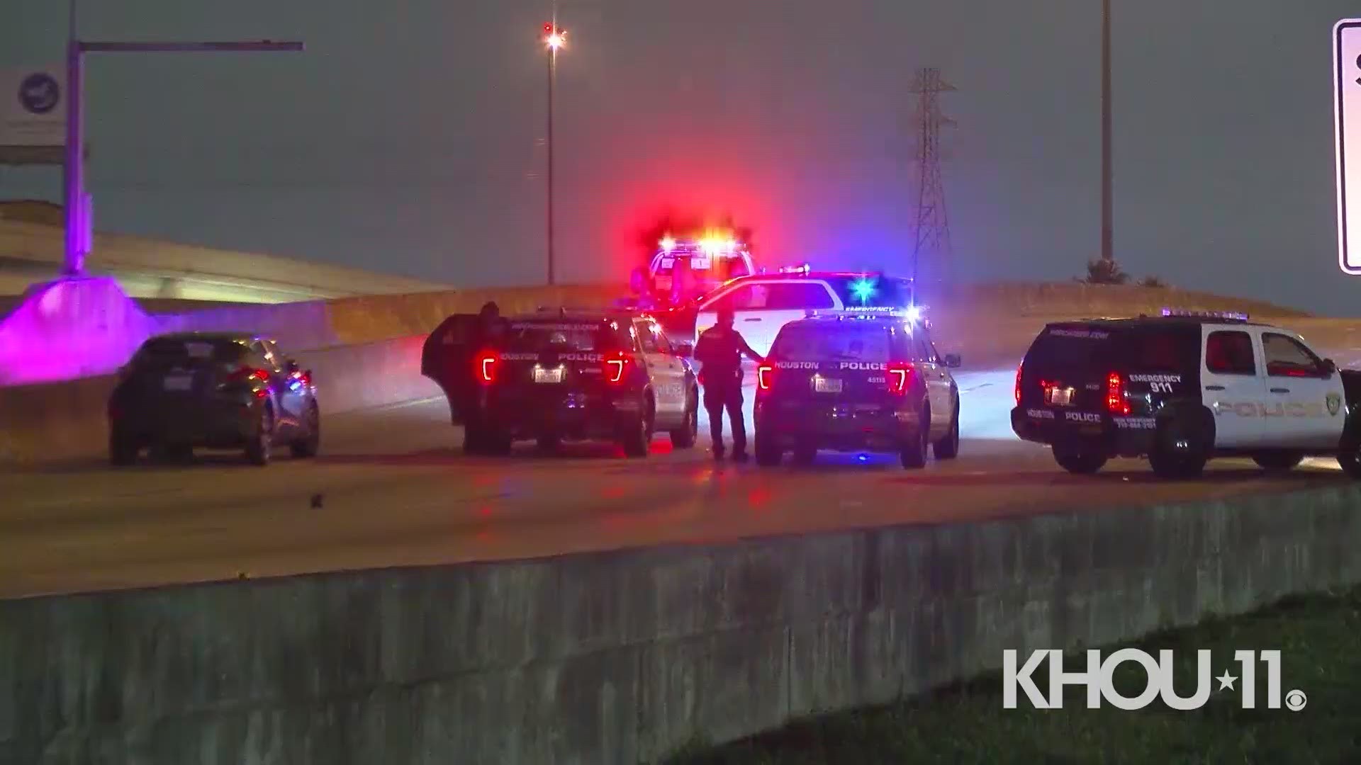 A man was arrested on a charge of driving while intoxicated after a crash that killed two pedestrians on I-45 the Gulf Freeway Saturday morning.