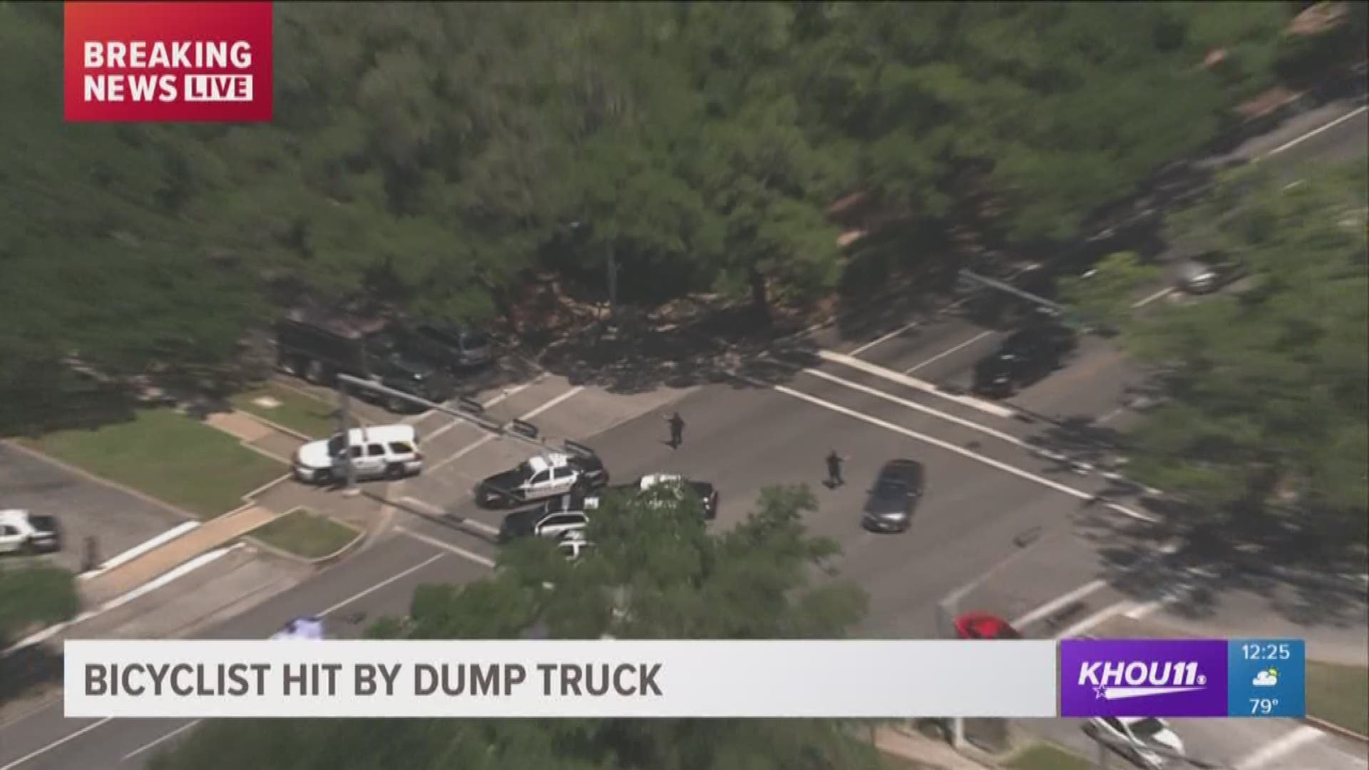 Police say a woman died after being hit by a dump truck, while riding her bike near Rice University Tuesday.