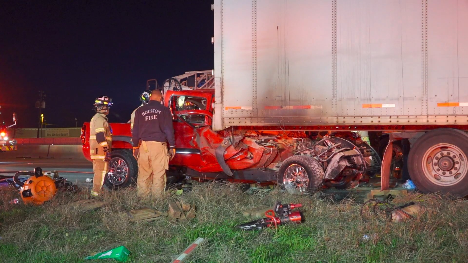 The driver of the pickup truck was trapped inside after slamming into a parked big rig, officials said.
