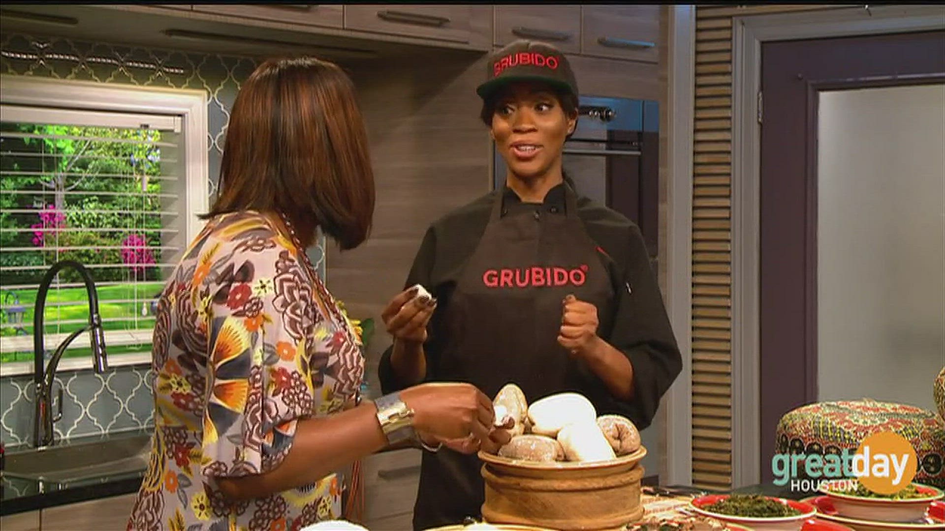 Michelle Kavachi Unegbu, founder of Grubido, demonstrates how the African dish, Fufu, is eaten.