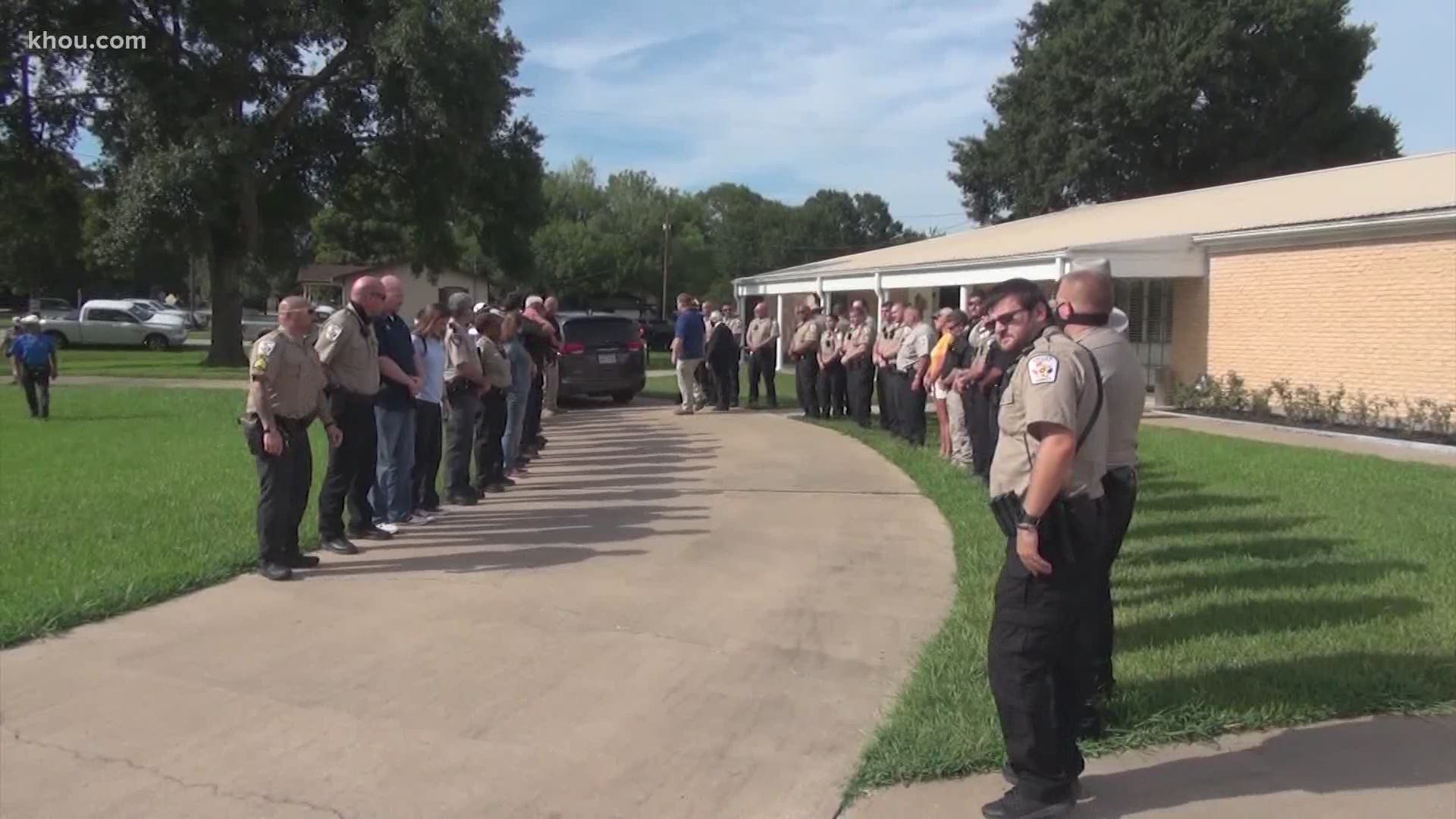 About 100 deputies took part in a procession for Waller County Sheriff Glenn Smith who died of an apparent heart attack.