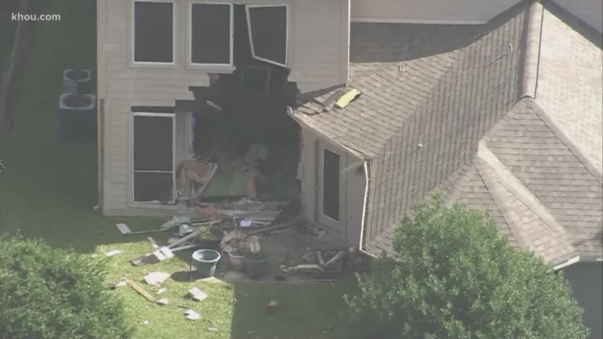 A 29-year-old driver has been charged with driving without a license and reckless driving after he plowed into a Katy home.