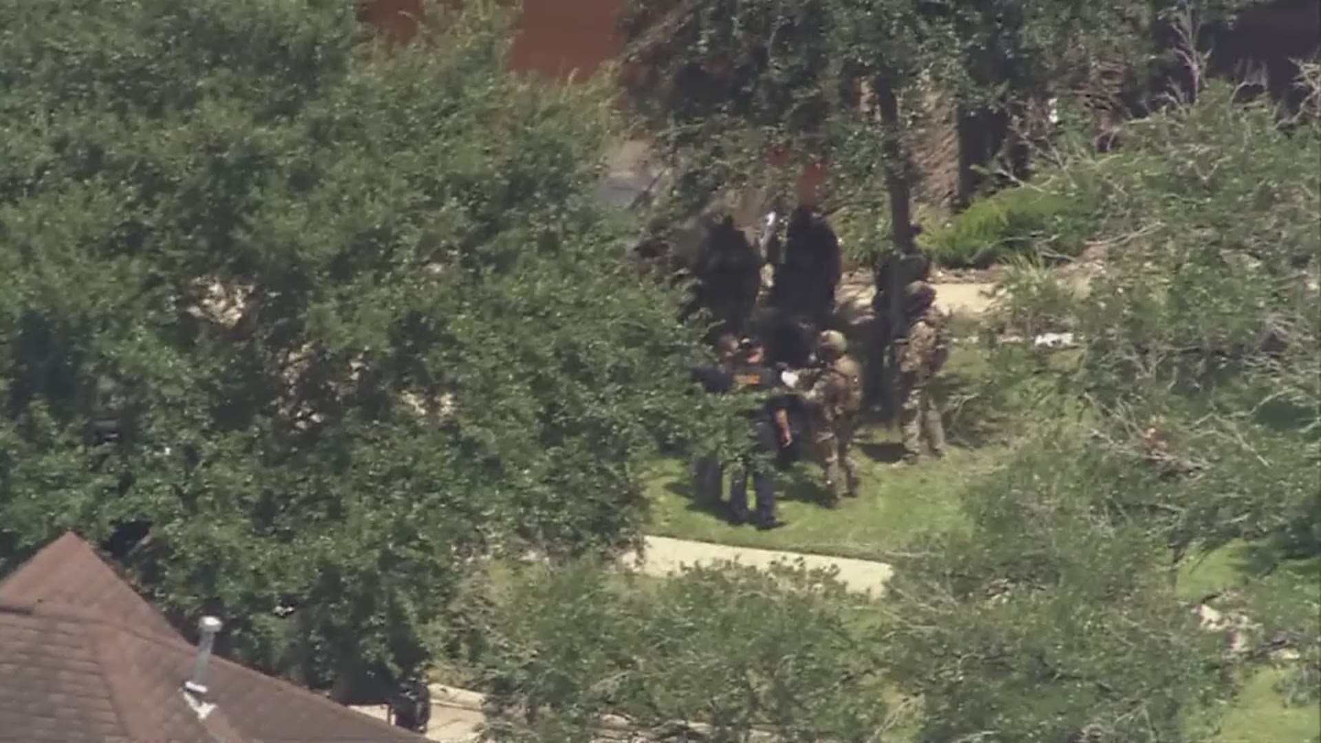An armed suspect was taken into custody following an almost four hour standoff with police in a Bellaire neighborhood near the West Loop Friday morning.