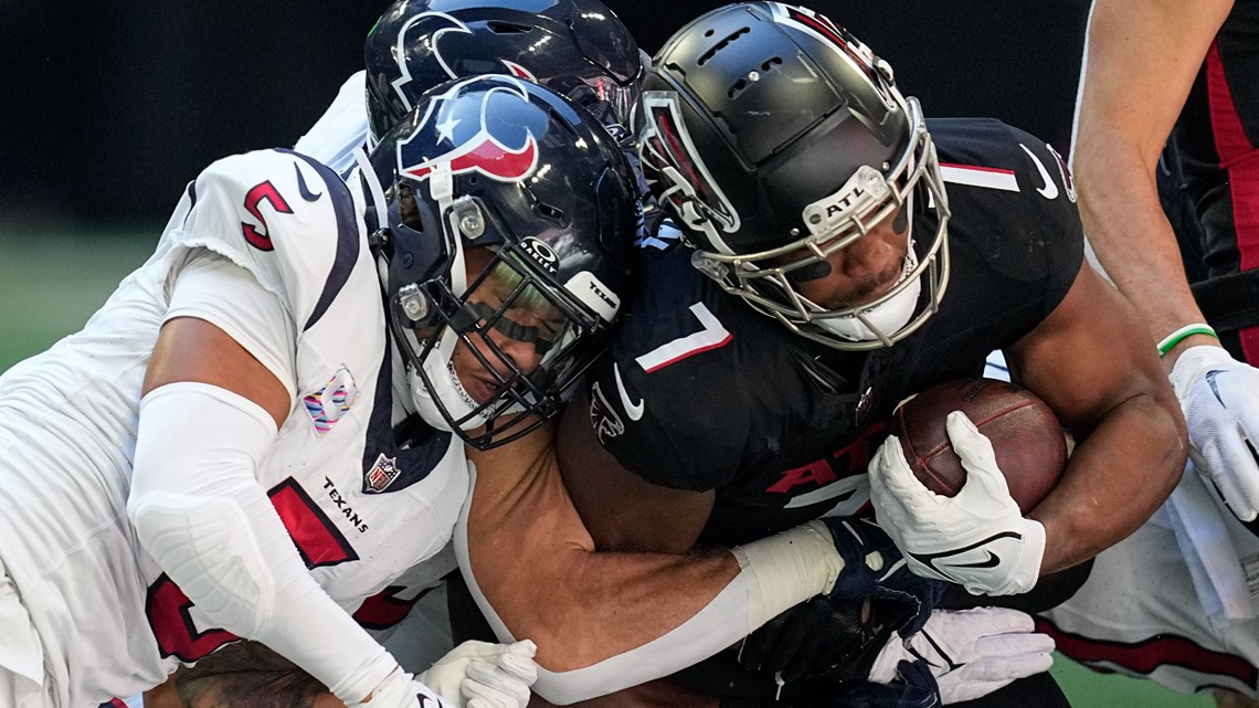 Houston Texans safety Jalen Pitre (5) warms up before an NFL