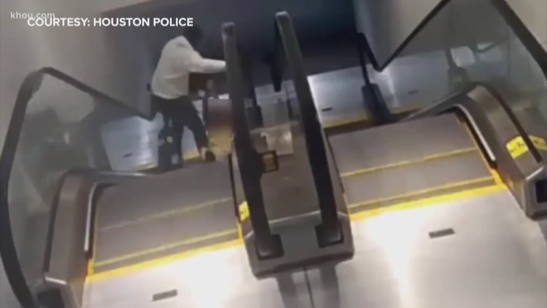 Surveillance video shows the moment a thief sneaks up on a woman on an escalator in The Galleria and robs her.