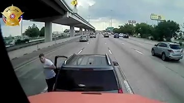 Road rage video: Houston driver stops in middle of freeway, gets out of SUV, throws punch at truck driver