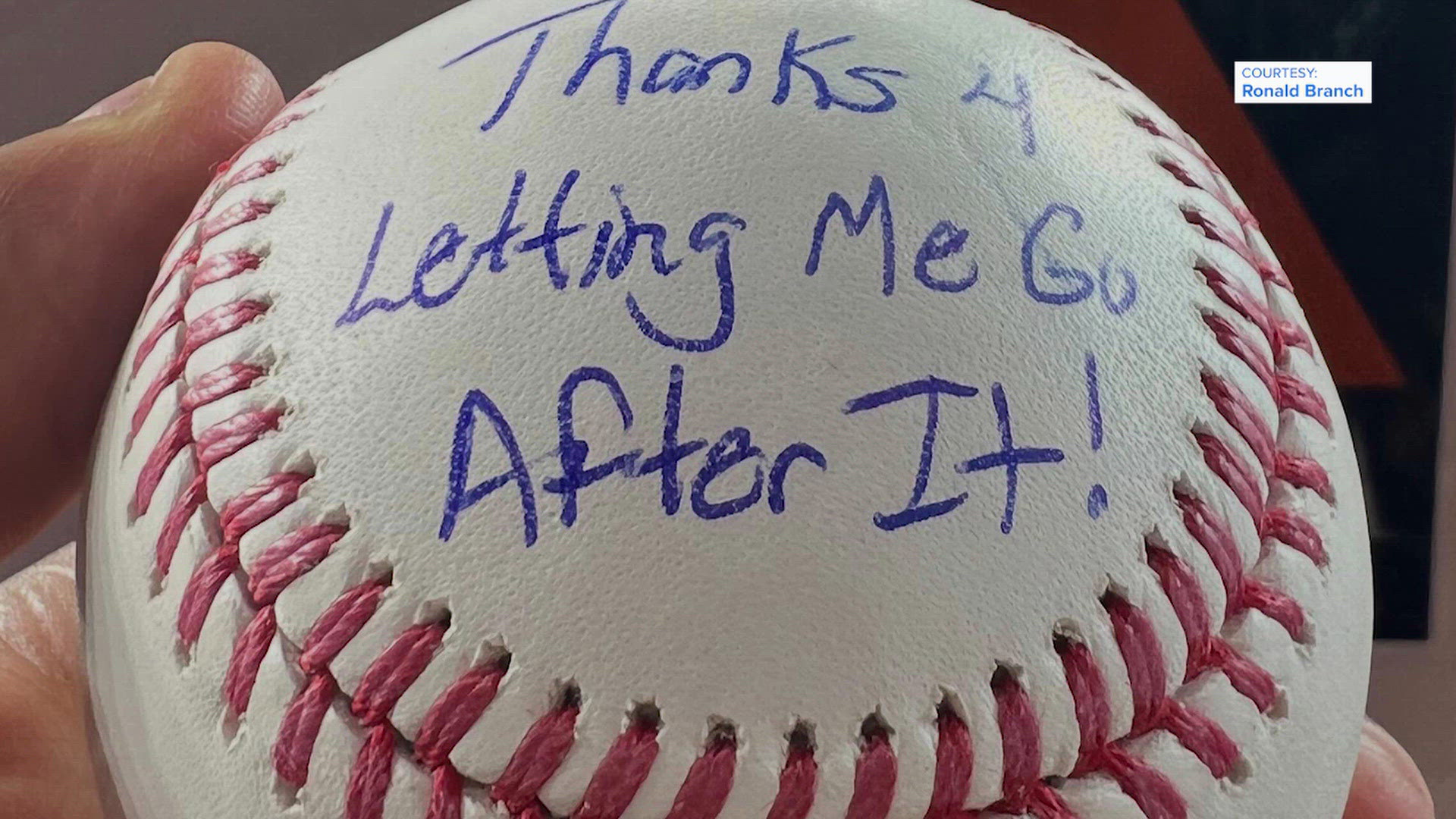 Rangers' Brandon Nimmo gives Astros fan a baseball with a message written on it