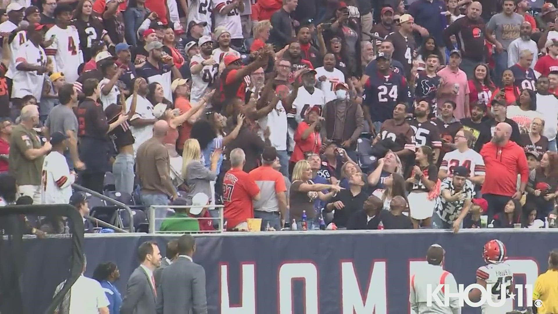 Photojournalist Mike Orta captured video of the fan falling down, then getting back up with the ball.