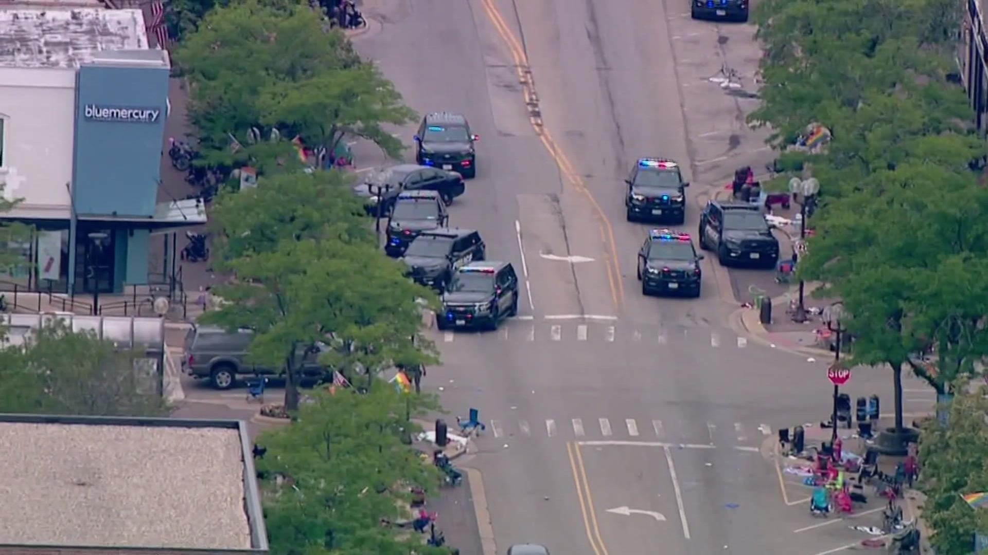 The gunman who opened fire on the Highland Park parade from a rooftop is not in custody, according to officials.