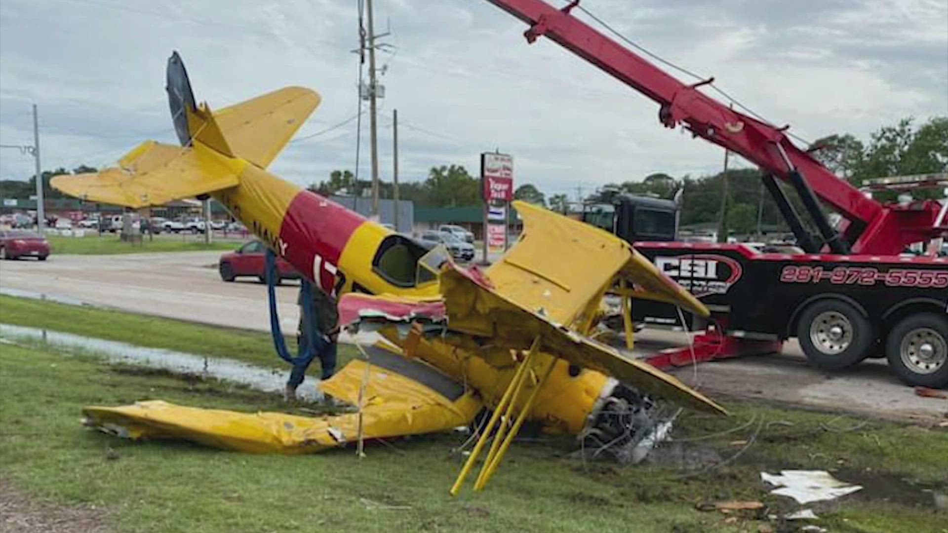 A photo provided by the Chambers County Sheriff’s Office shows the damage. The photo shows a yellow plane overturned alongside the highway.