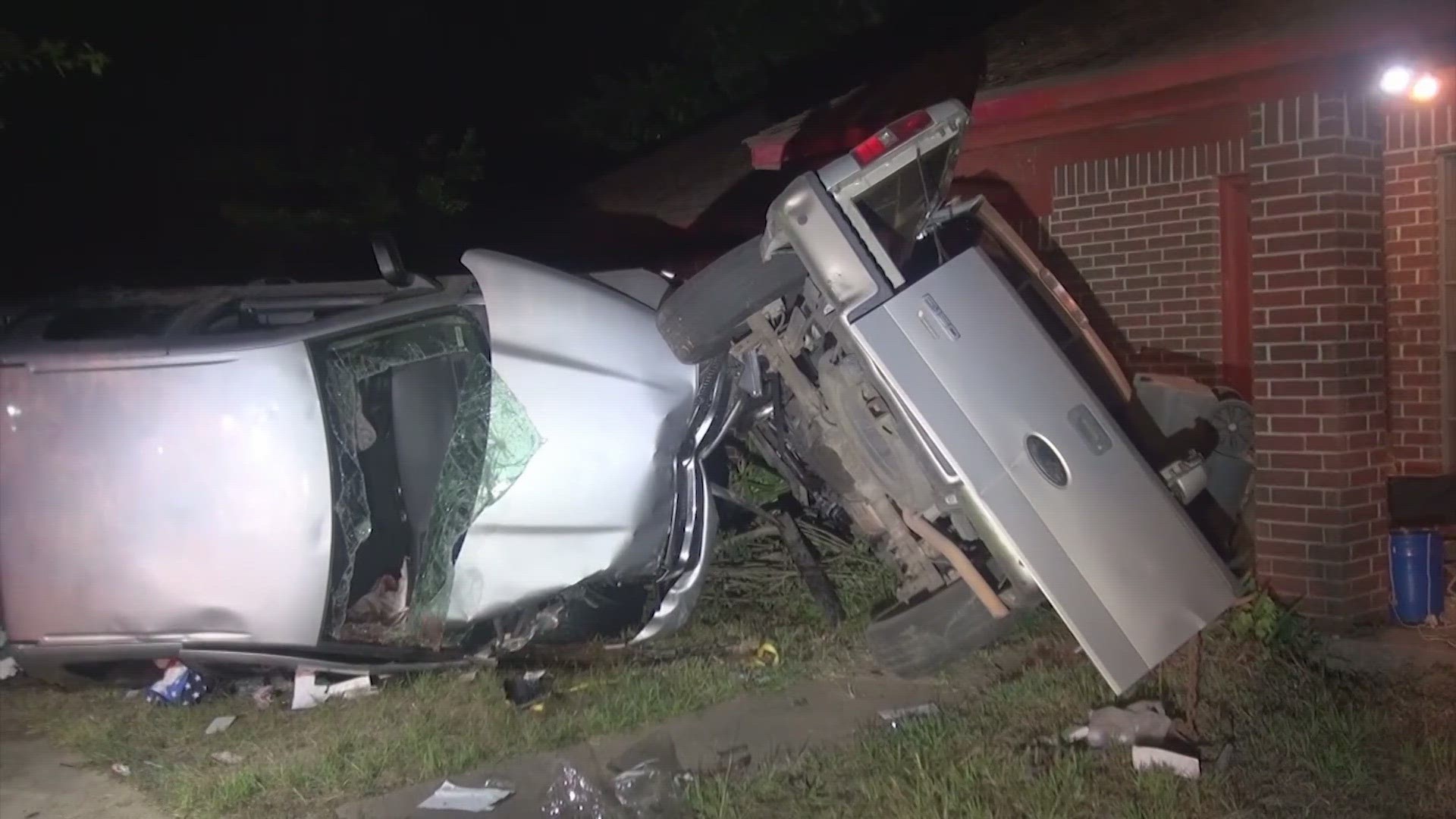 Officials said the truck T-boned another truck parked in the driveway, sending it into the home.