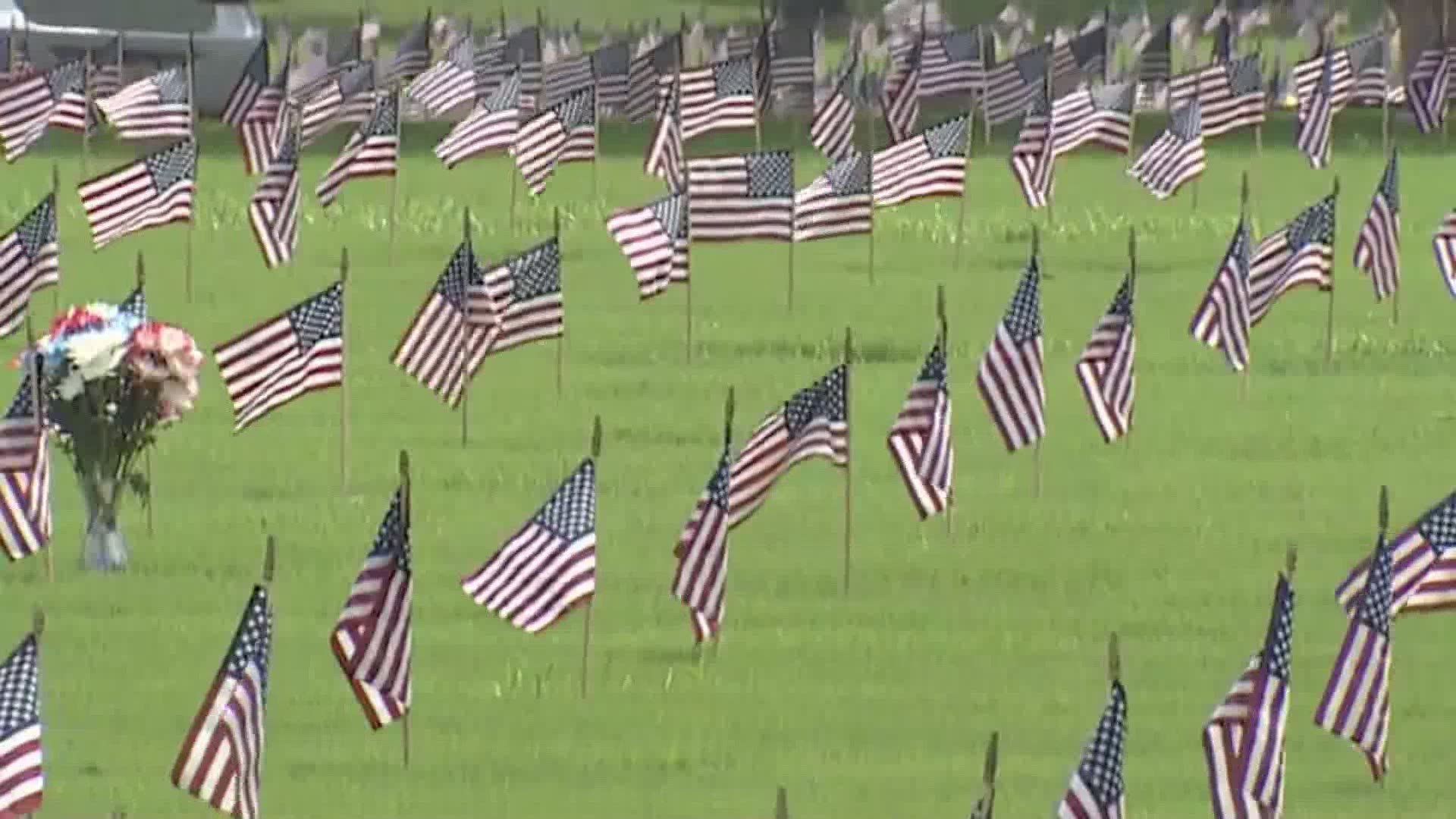 Flags were placed on the graves of more than 100,000 veterans buried at Houston National Cemetery in honor of Memorial Day.