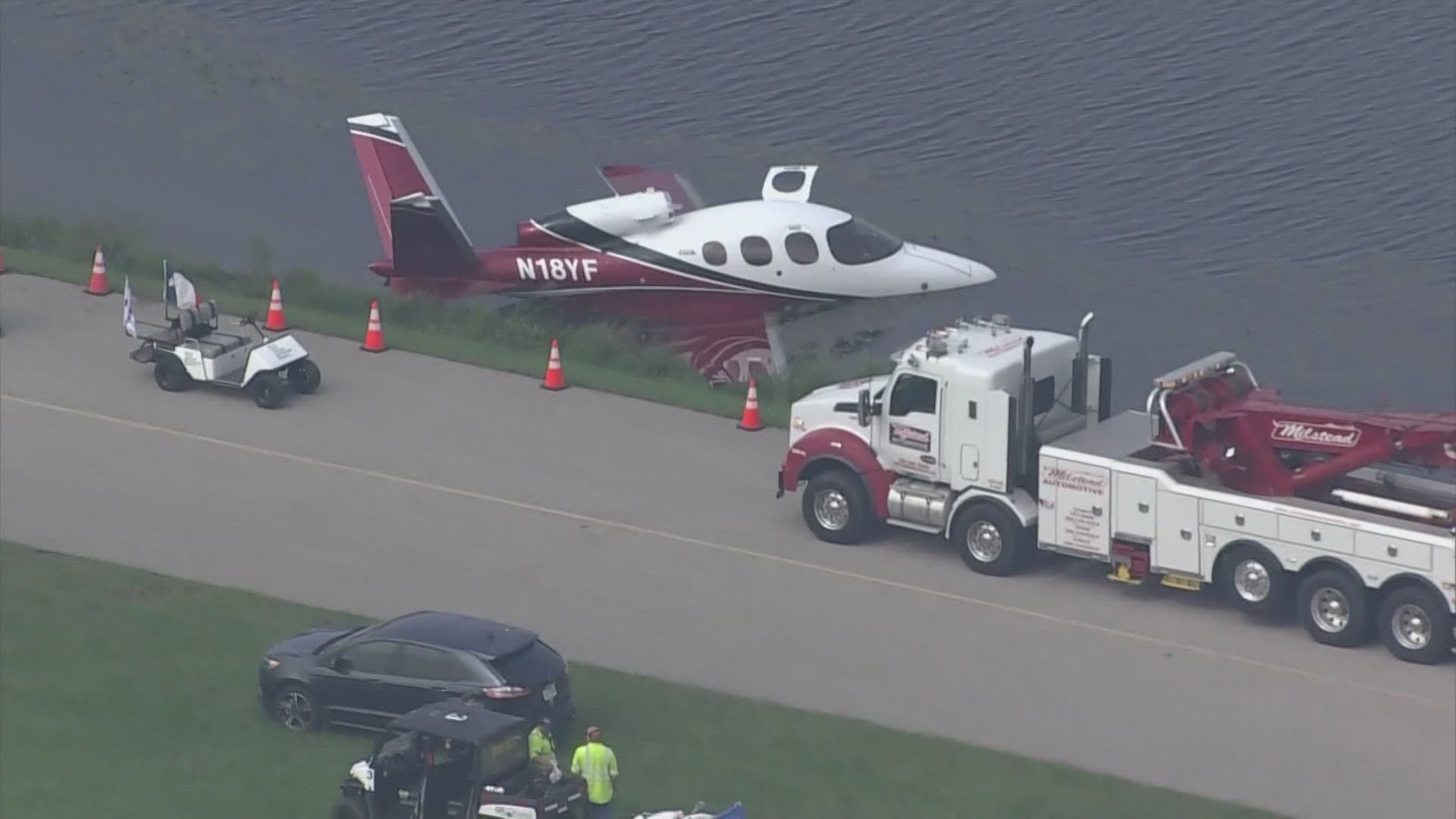 Three people and two pets were pulled from a plane Tuesday morning after it ended up in the water at Hooks Airport in northwest Harris County.