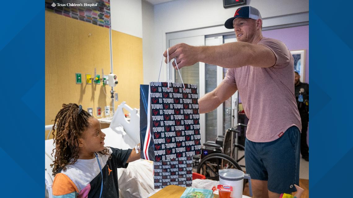 JJ Watt with Baby Son at Houston Texans Ring of Honor Induction