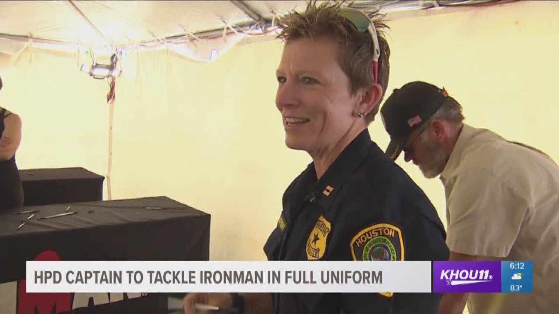 Capt. Kristine Anthony is running the 26.2 miles in her police uniform, wearing a sign that states she is raising money for Special Olympics Texas.