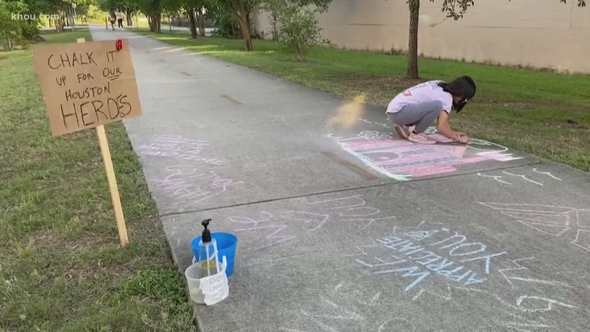 Houston neighbors are decorating sidewalks with inspiring messages and images written in colorful chalk.