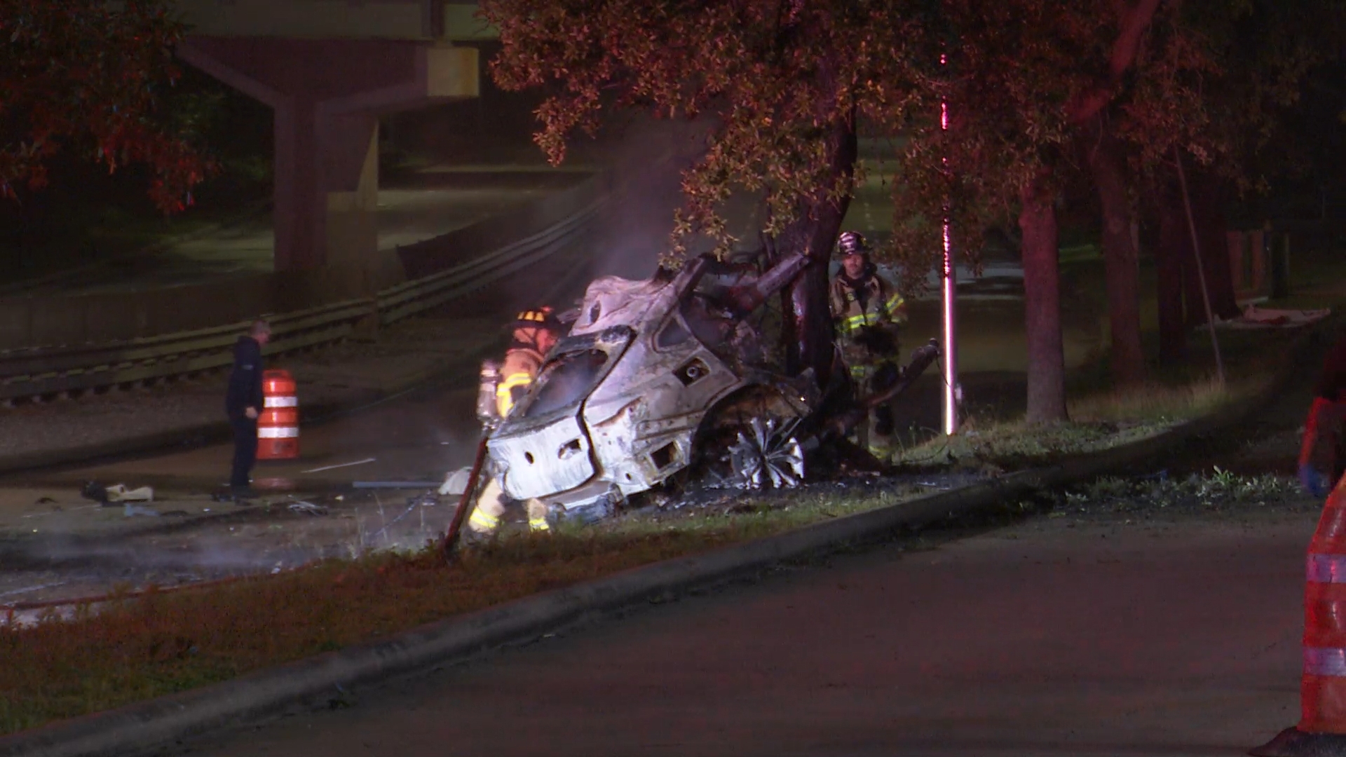 A woman died in a fiery crash that left their vehicle split in half on Memorial Drive Wednesday morning, according to the Houston Police Department.