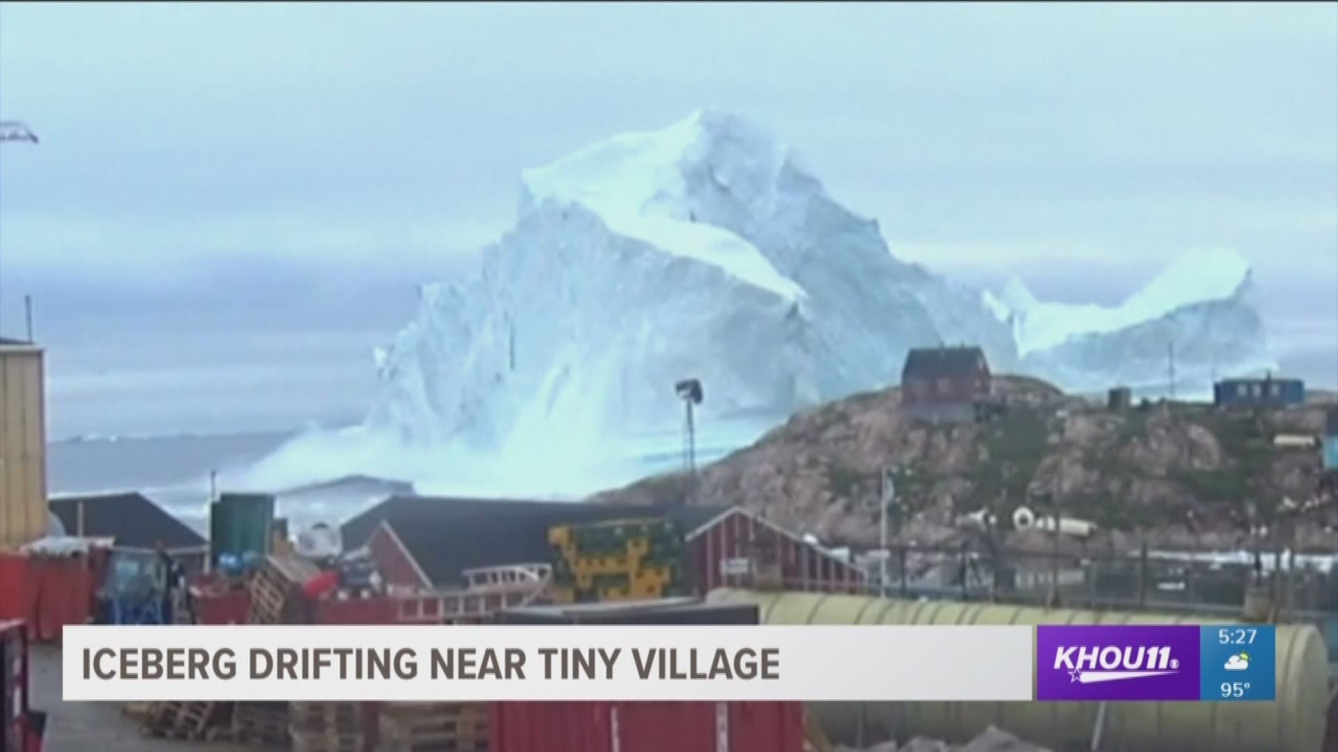 A remote village in Greenland is threatened by a 300 foot iceberg. Pieces of it are breaking off and crashing into the water nearby. 