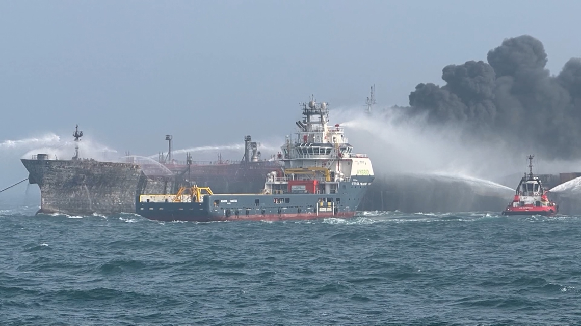 Fire rages after cargo ship hits US tanker | khou.com