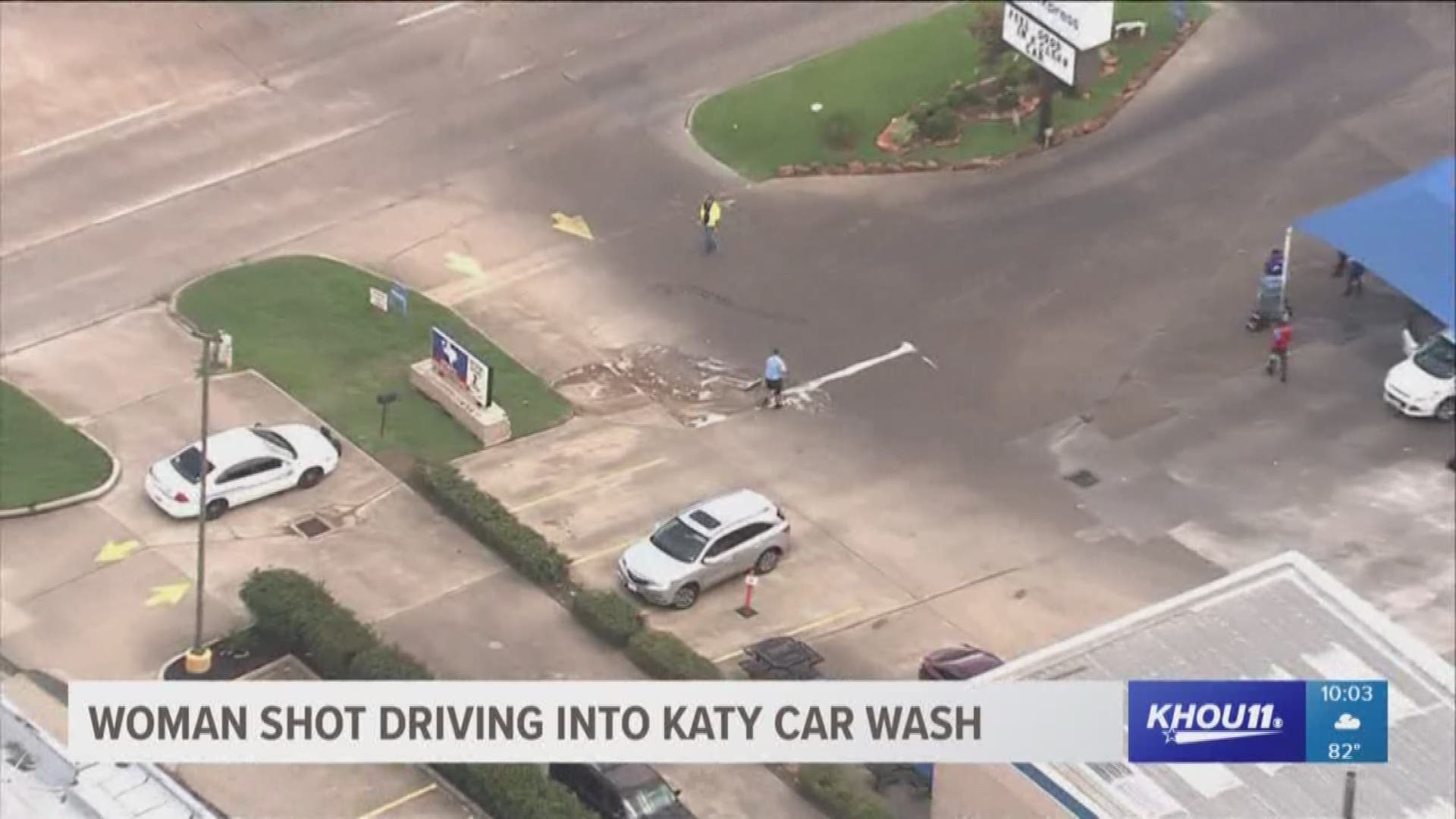 The search continues for a gunman in Katy after a woman was allegedly shot in the arm as she pulled into a car wash.