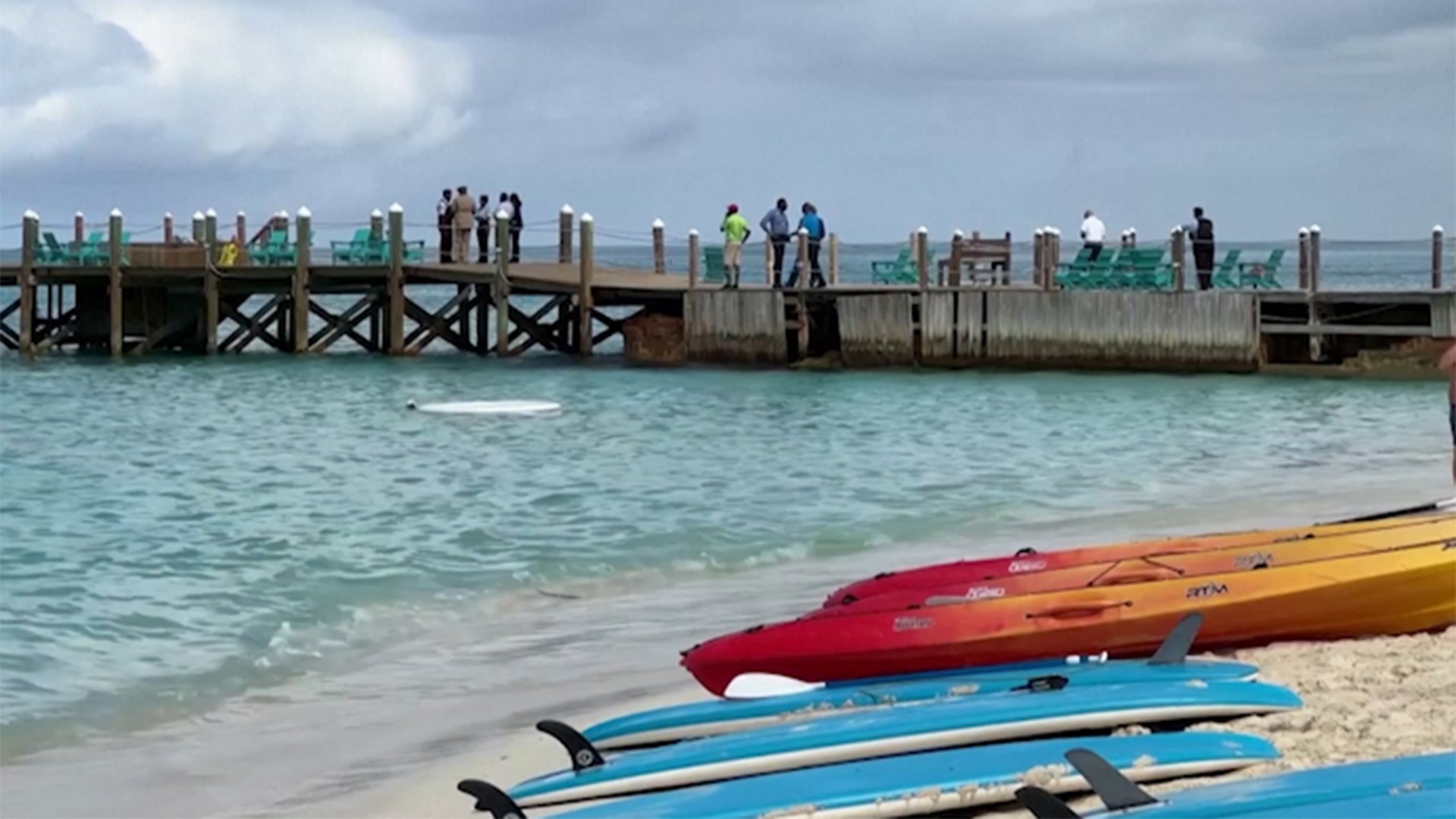 The woman, who police in The Bahamas, said was paddleboarding was less than a mile from shore when she was attacked.