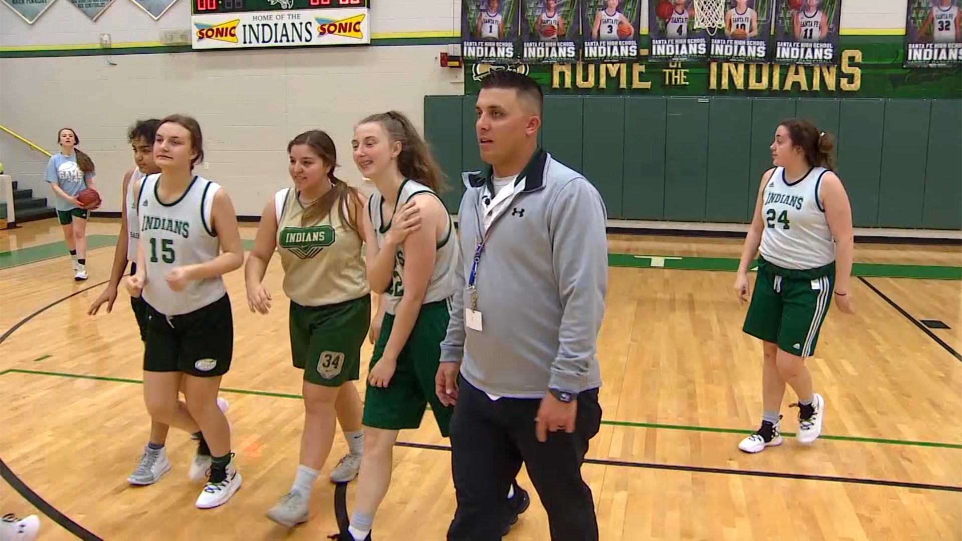 Players on Santa Fe High School's junior varsity girls basketball team share their favorite memories of coach Jonathan Burns.